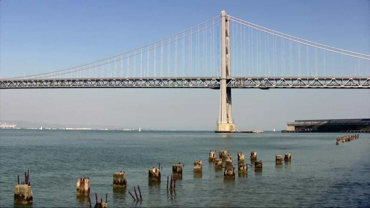 A modern view of the San Francisco-Oakland Bay Bridge over the water.